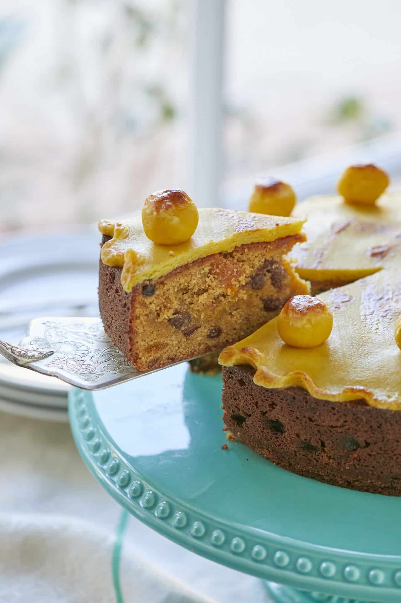 A slice of Easter Simnel Cake loaded with brandy-soaked dried fruit and nutty marzipan.
