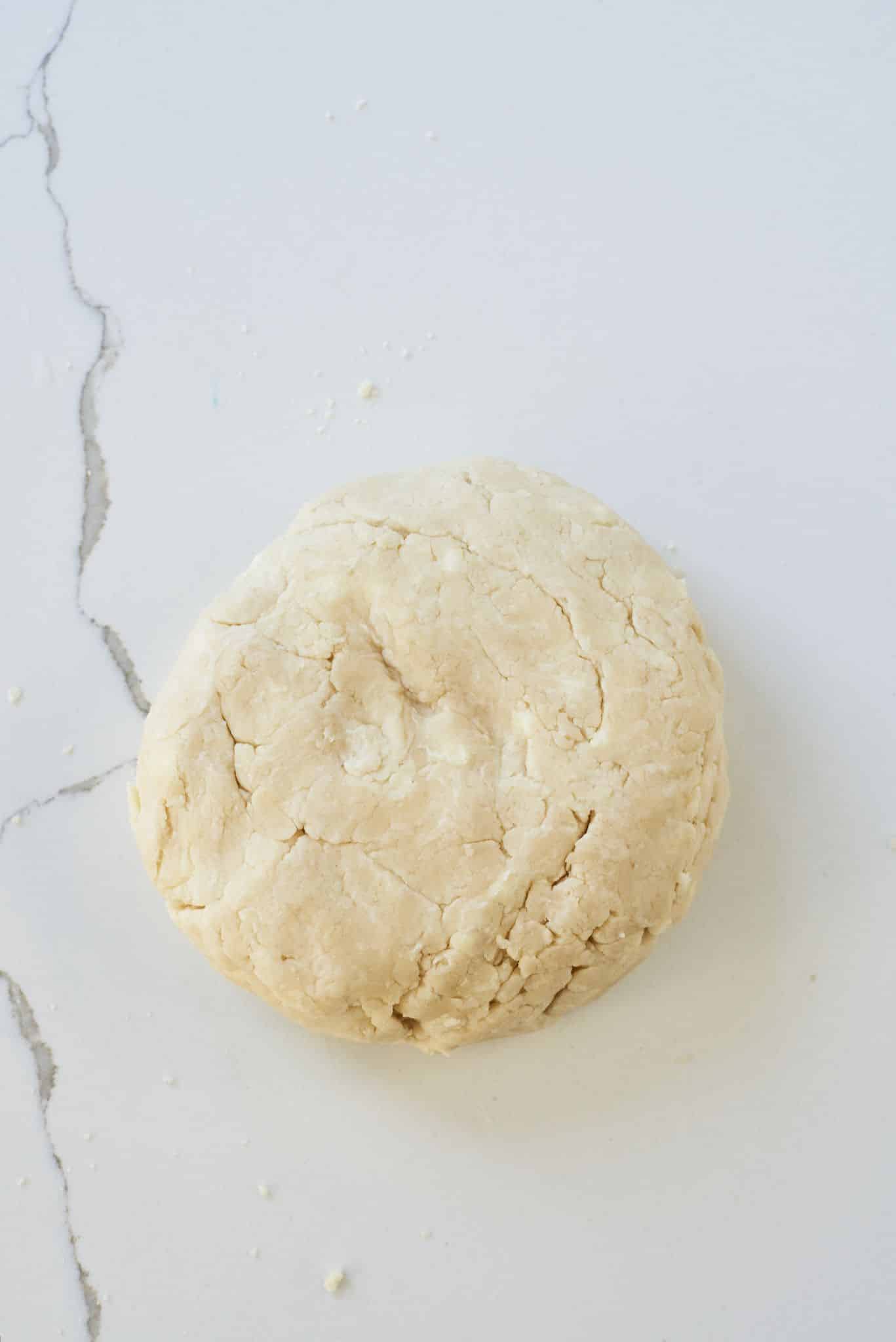 Add sour cream until it forms a rough dough. 