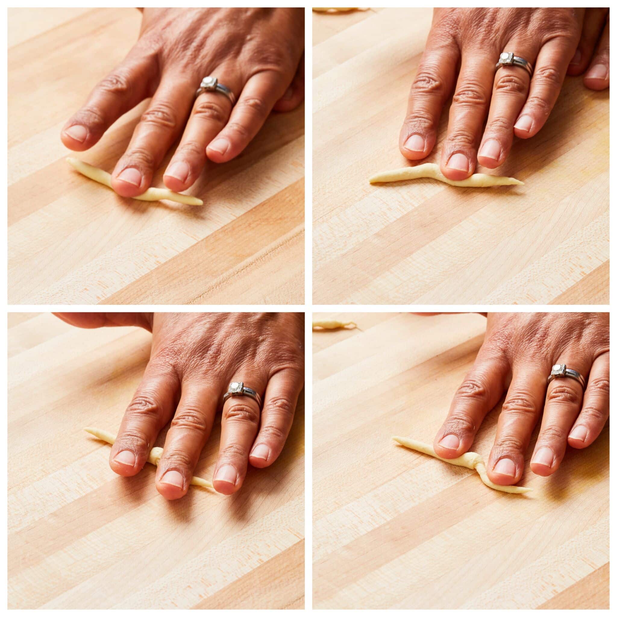 Step-by-step instructions on how to shape Trofie pasta: Working with one piece of dough at a time, imagine that there is a large triangle pointing away from you on your work surface. Place only one piece of dough at one corner of the imaginary triangle close to you and using a flat palm, roll the dough along the triangle (diagonally away from you) to the far tip and then down the other side. When you get to the opposite end of the triangle, the dough should have rolled off of the outer edge of your palm. This should create a gentle, spiral shape. 