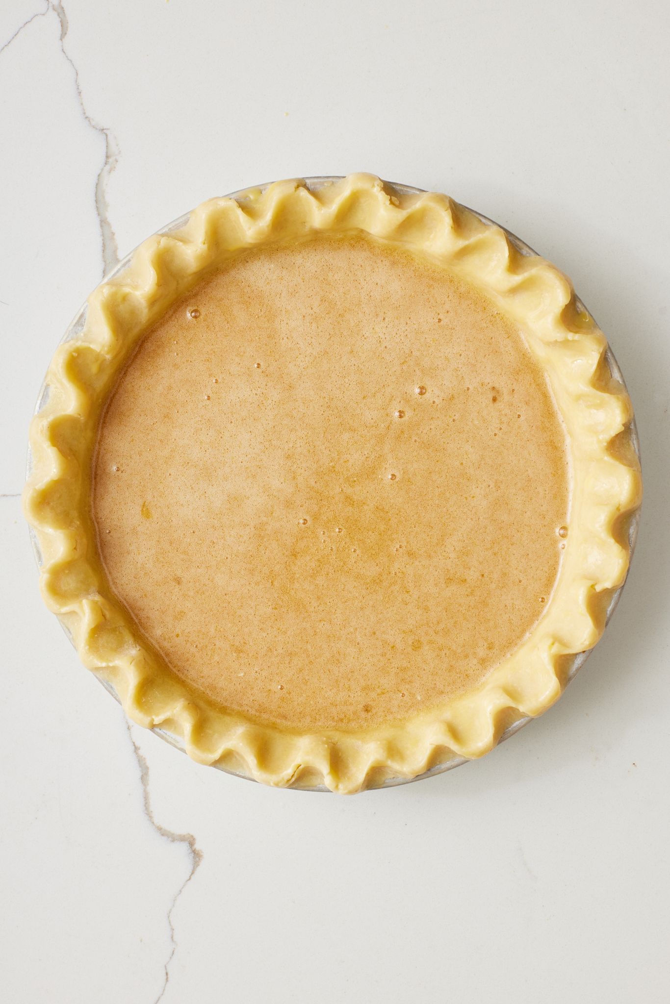 Chess pie6 Add filling to the pie crust.