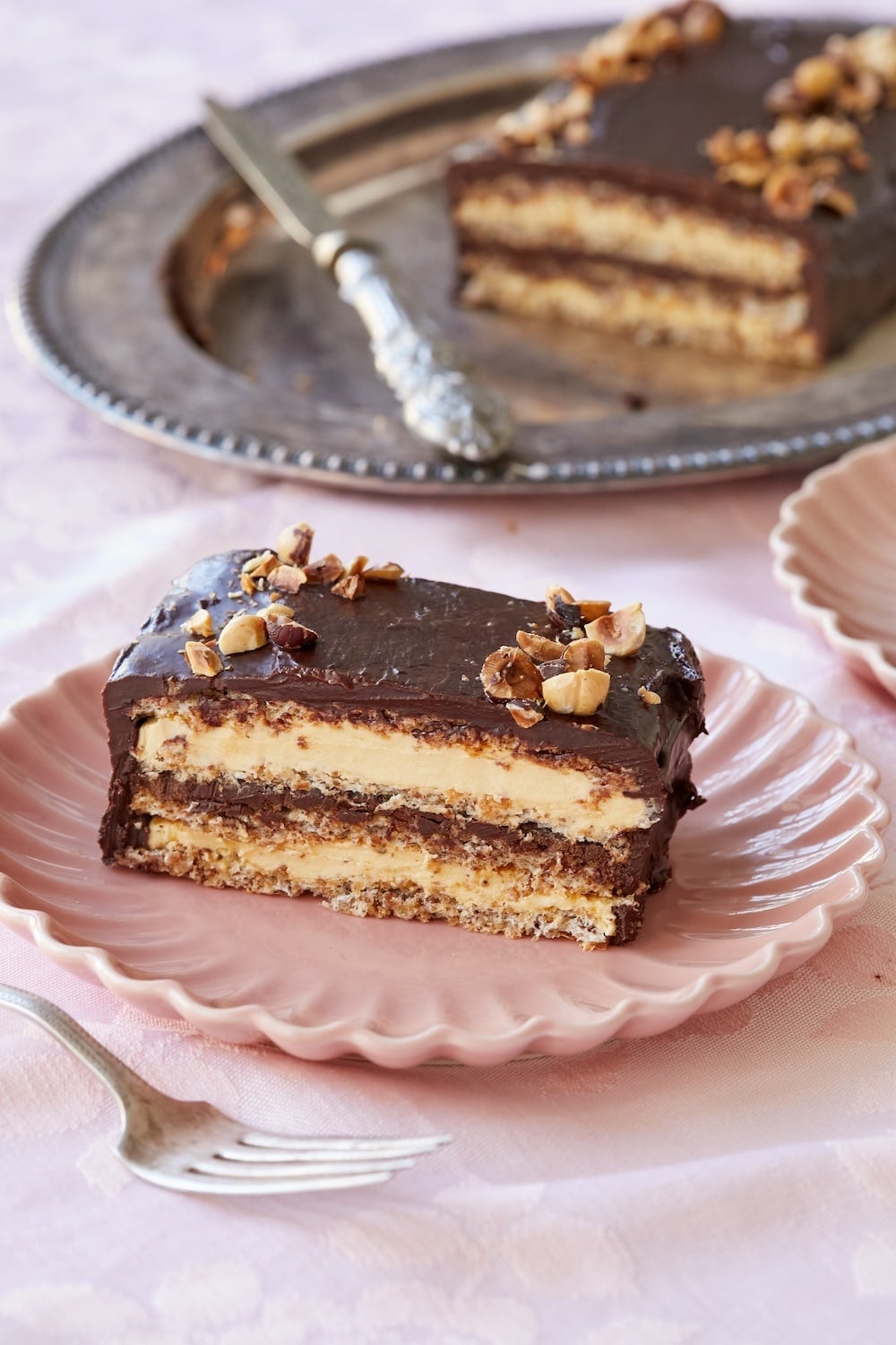 Marjolaine Cake with two layers and chocolate frosting. 