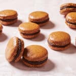 Mocha Macarons are baked perfectly with feet and shinny top.