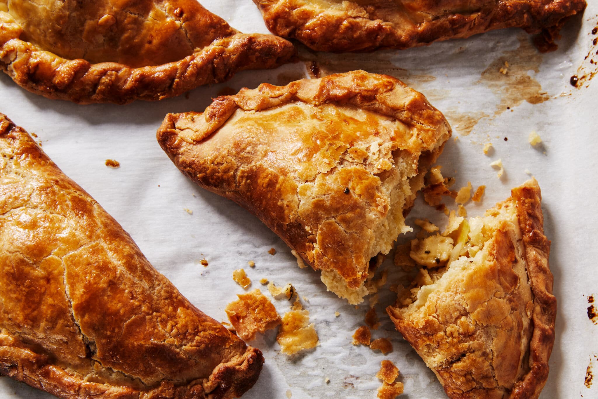 A close-up shot at Potato and Cheddar Pastries shows that they are baked until golden brown with crispy flaky crust.