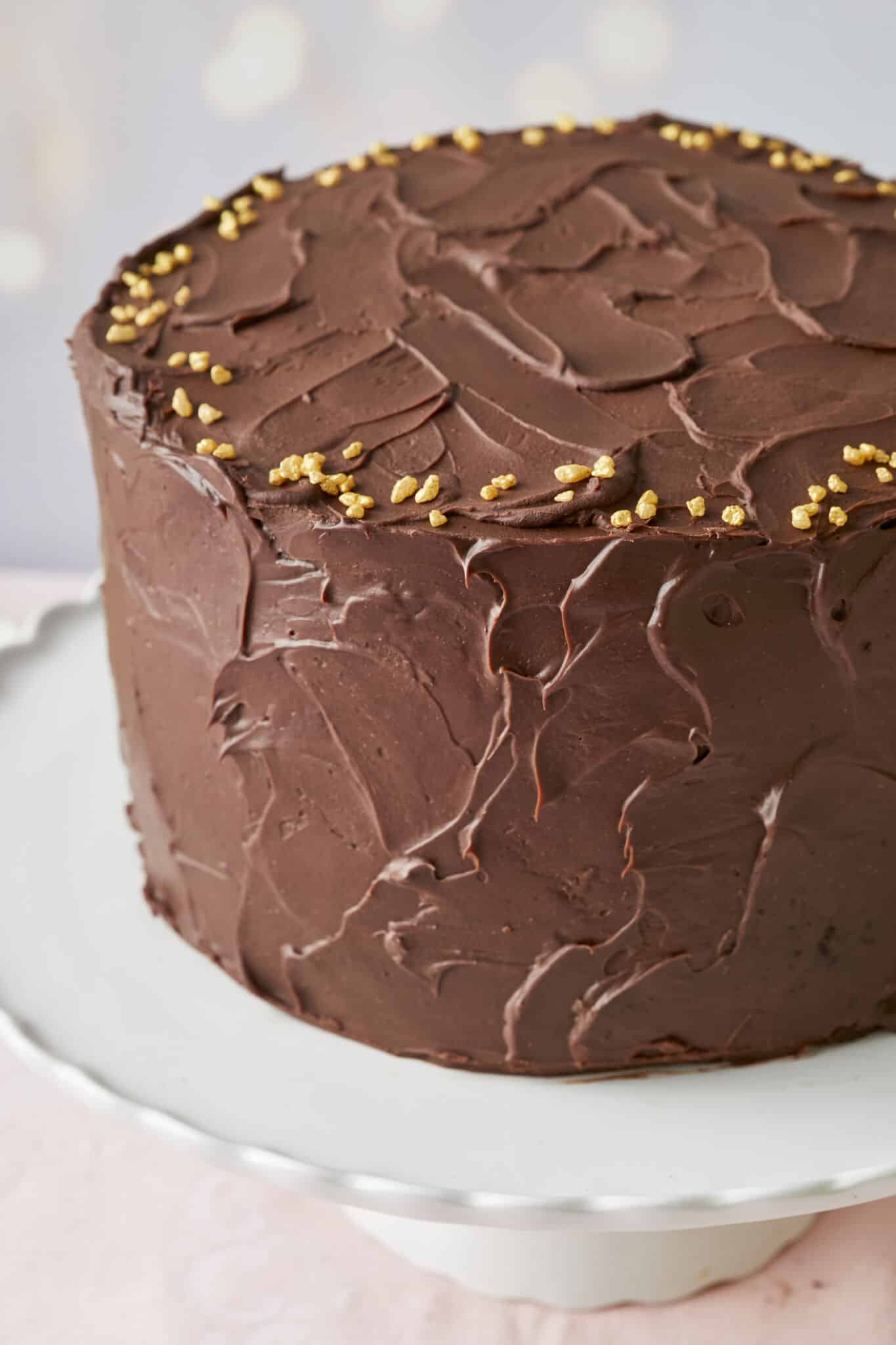 The Luxury 24-Layer Chocolate Cake is covered with silky smooth decadent ganache, creating the visually-impressive and sumptuous dessert of your dreams.