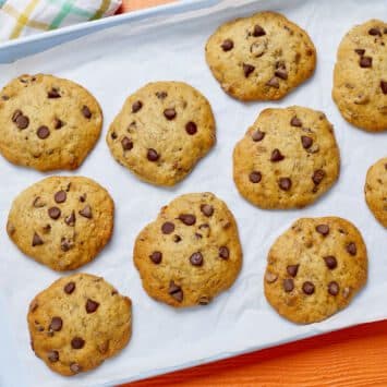 Banana Bread Chocolate Chip cookies are golden brown and loaded with chocolate chips.