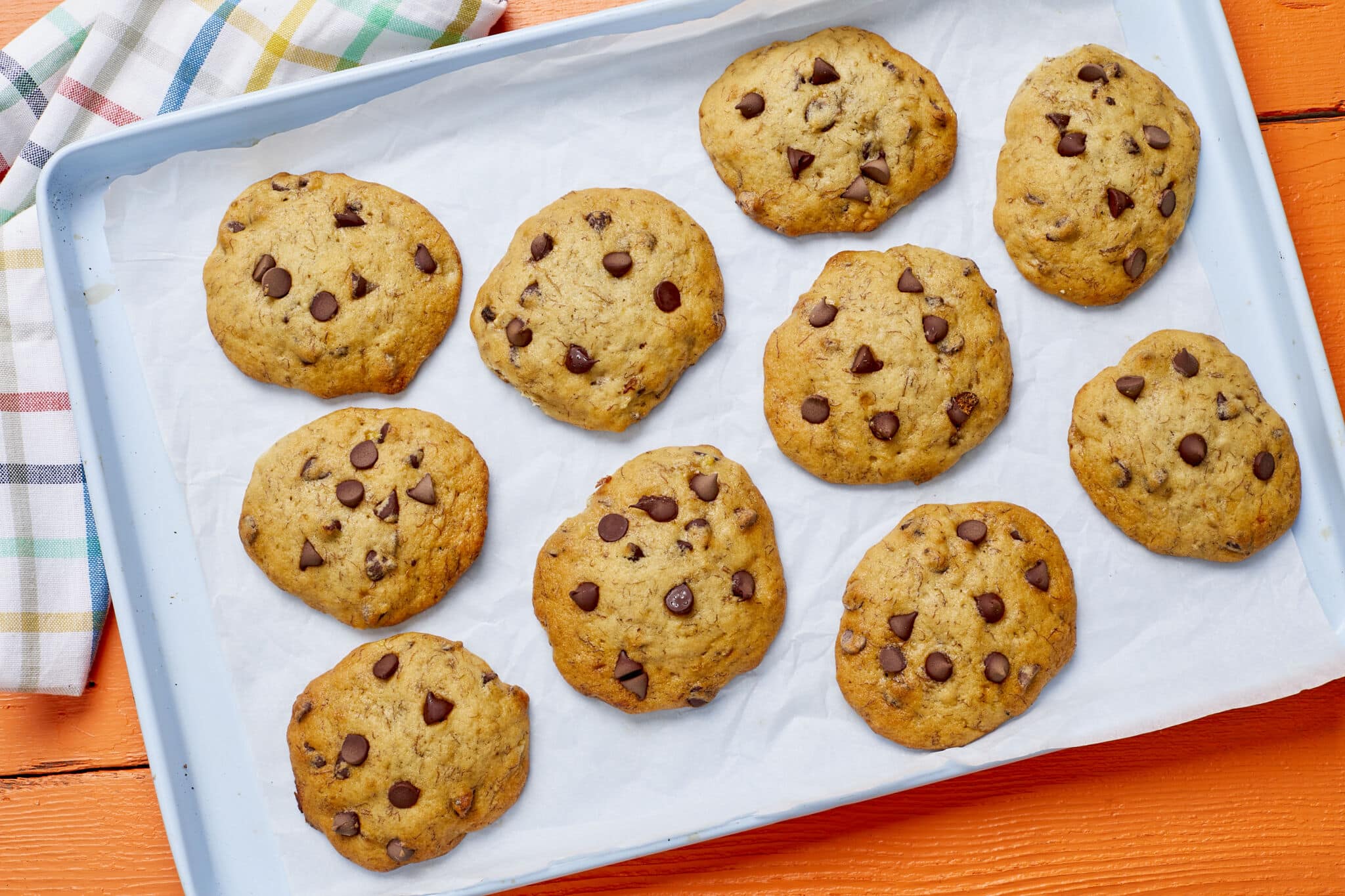 Banana Bread Chocolate Chip cookies are golden brown and loaded with chocolate chips.