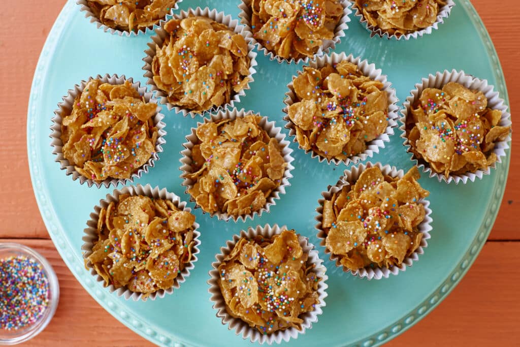 An over-head shot at Australian Honey Joys that are baked until crisp in cupcake cups then decorated with sprinkles.
