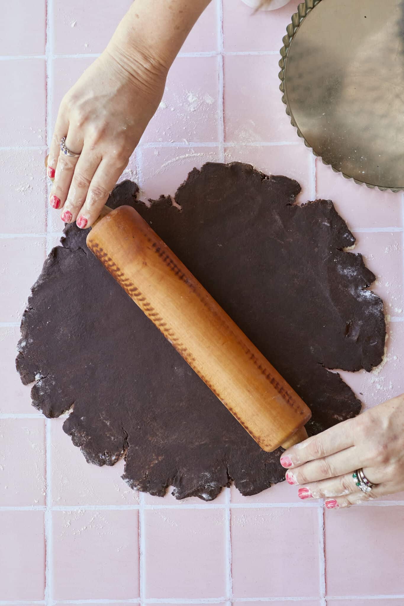 Step-by-step instruction on How to Make Chocolate Pastry: rolling out the pastry dough into a round disc. 
