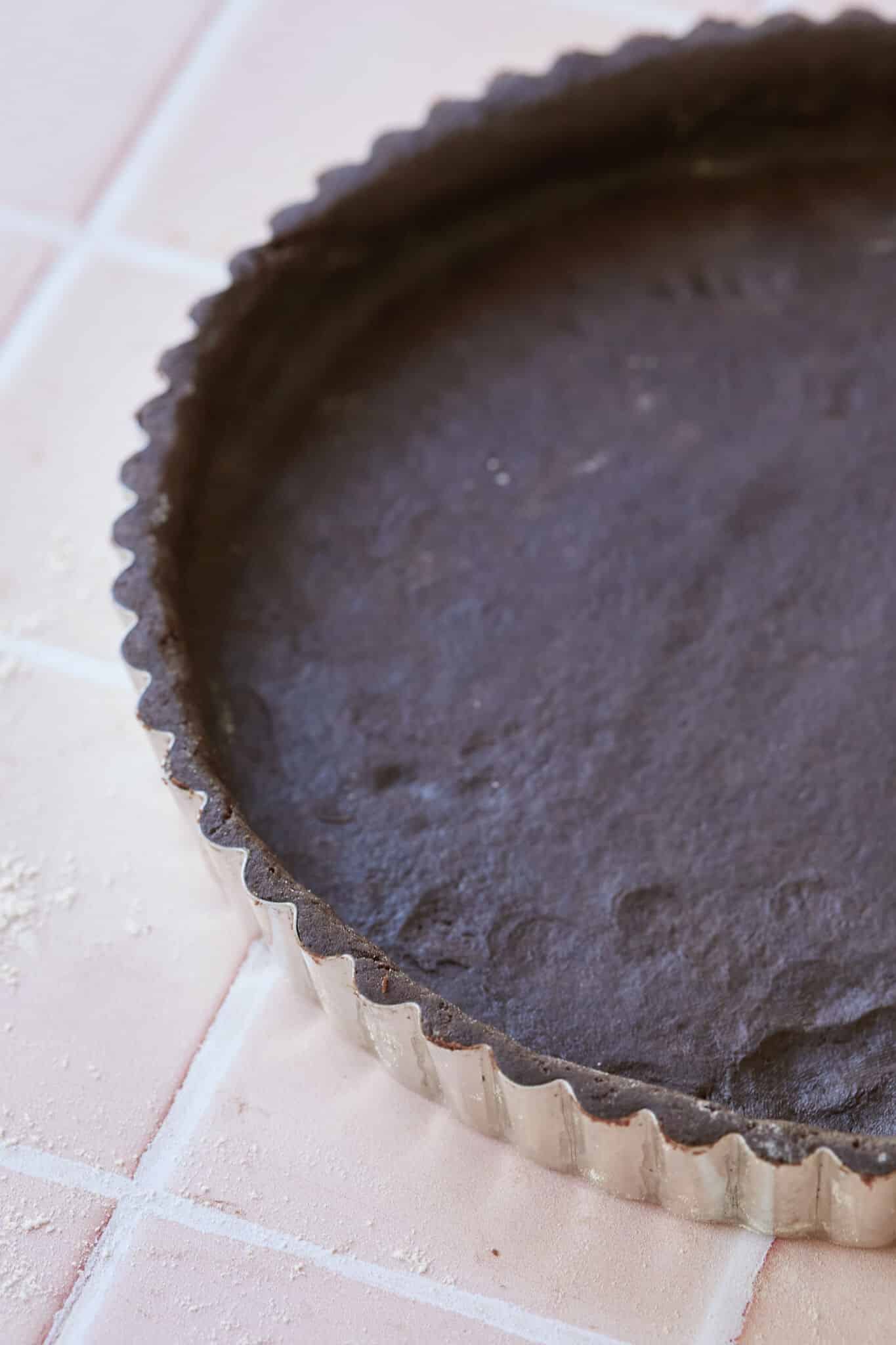 A close-up shot at the Chocolate Pastry that has is perfectly prepared in the fluted-edge pie pan. 