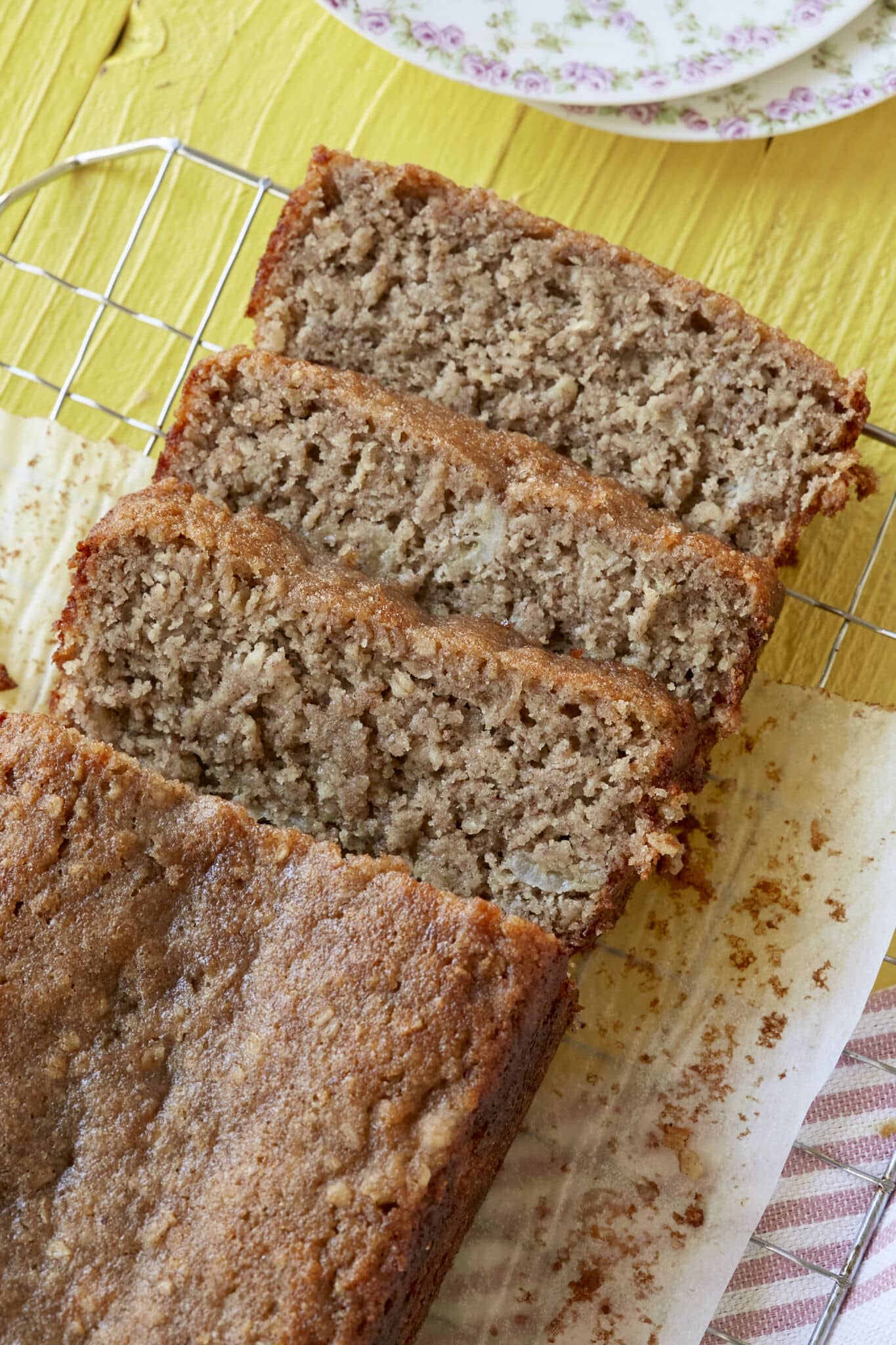 A close-up shot at Almond Flour Banana Bread shows its golden exterior and soft, moist interior. 