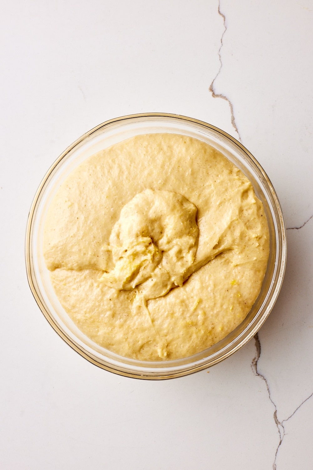 Italian Easter Bread brioche dough rising in the bowl. 