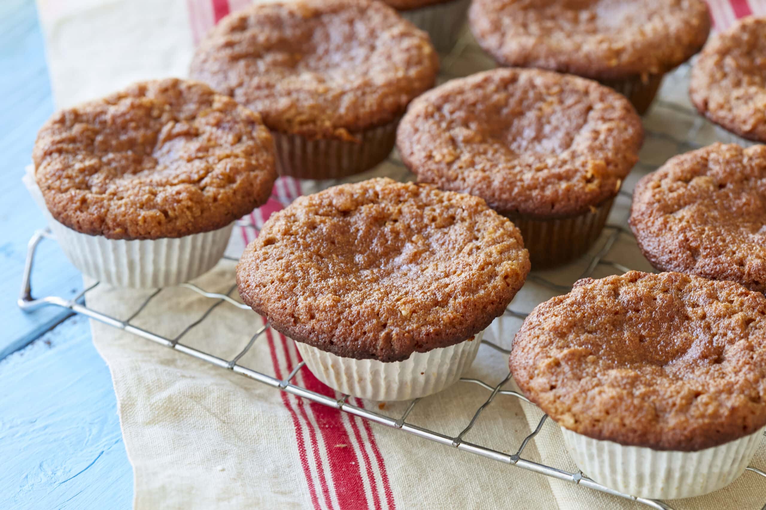 Healthy Almond Flour Muffins with applesauce are baked until golden brown, cooling on the rack.