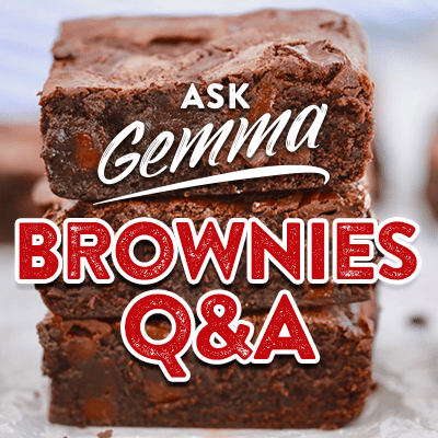 Brownies Q&A, Brownies Questions, a stack of gooey brownies with shinny crinkled top.