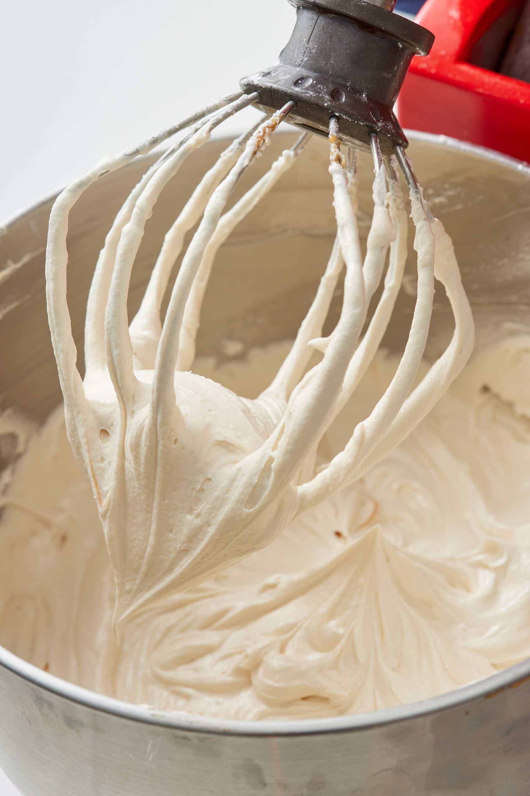 Aerate the frosting: Once all sugar is mixed in, turn the mixer to high speed and whip for 2 more minutes for a light, fluffy texture.