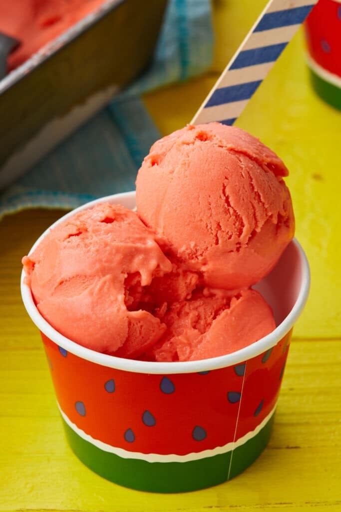 Watermelon gelato served in a paper cup