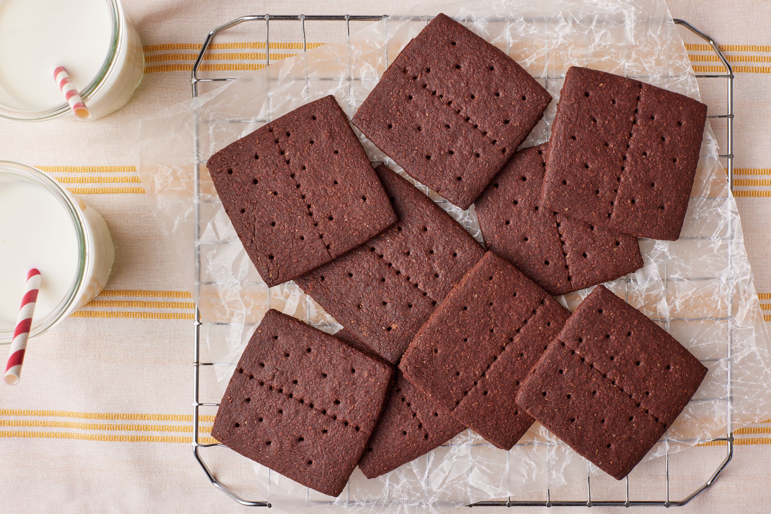 Chocolate Graham crackers o the cooling rack, served with milk .