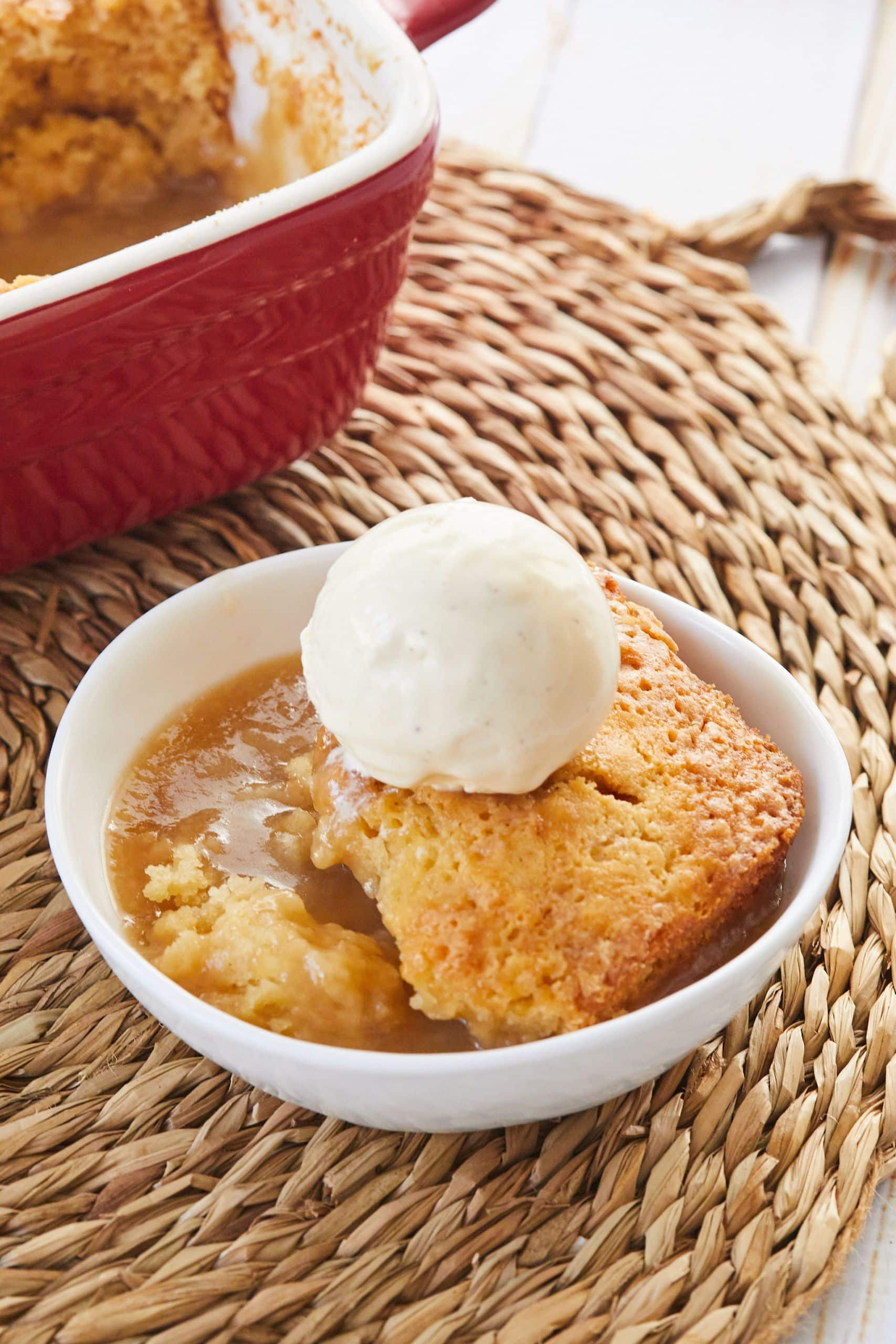 Golden Self Saucing Butterscotch pudding served with a scoop of ice cream. 