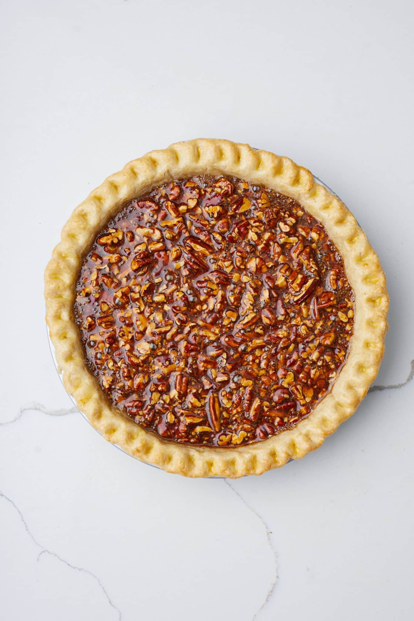 Pour the filling into the frozen crust and egg wash the edges.