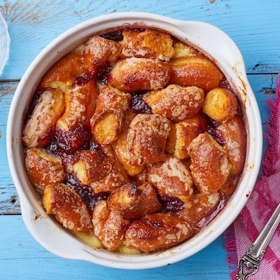 Donut Bread Pudding is baked golden brown with gooey jam.