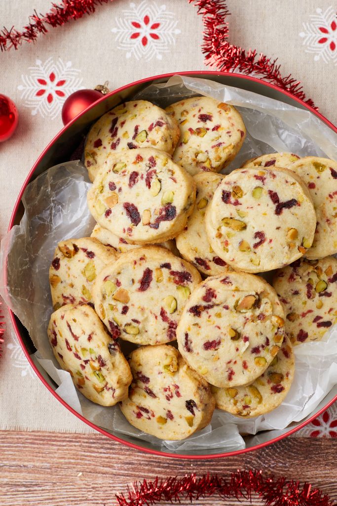 A tin of cranberry pistachio shortbread cookies