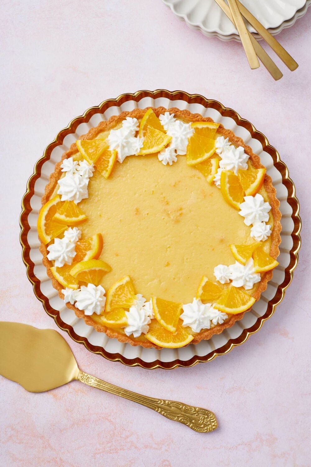 orange tart 9 Orange Tart with golden crust is decorated with orange slices and whipped cream rosette.
