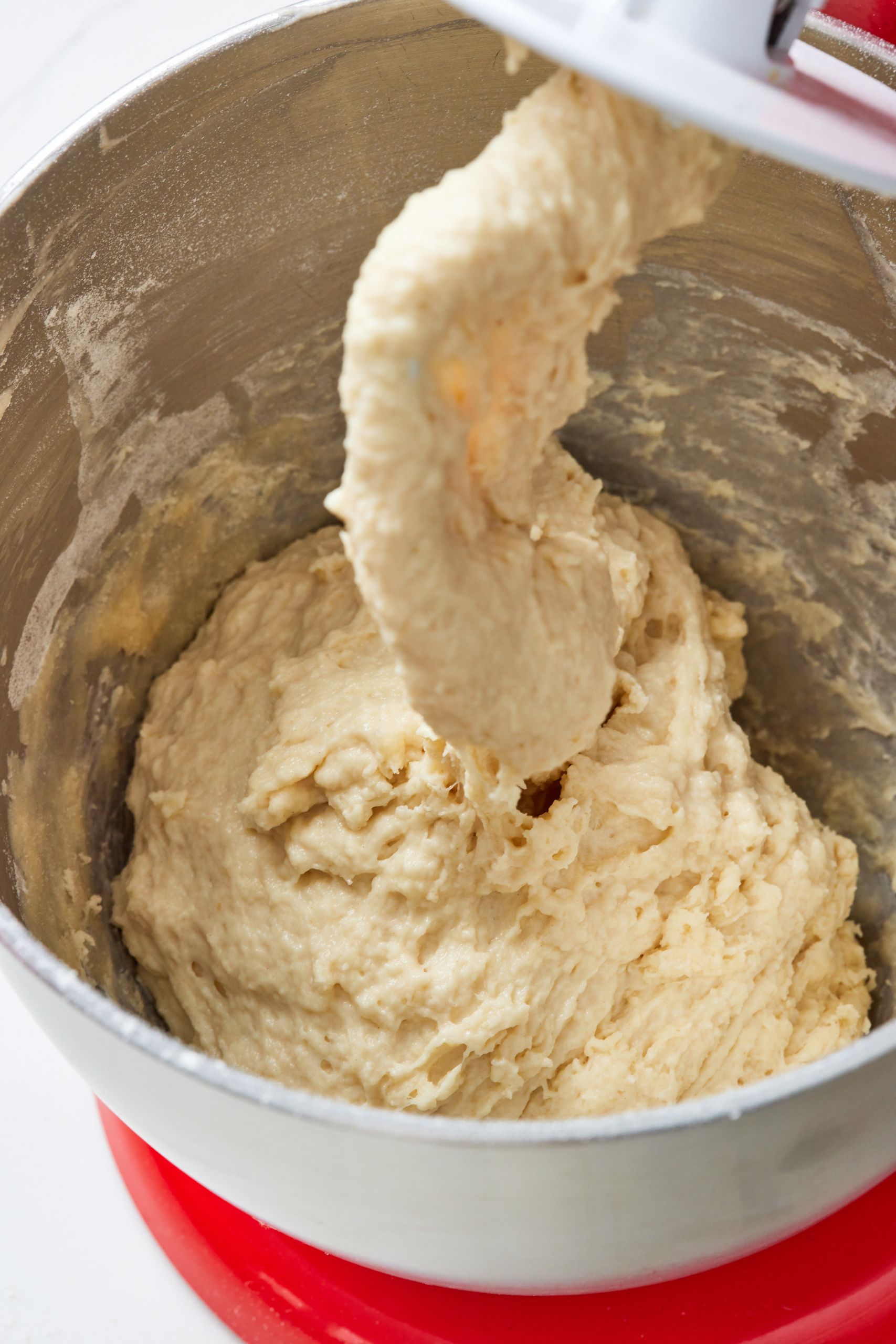 Step-by-step instructions on how to make Sourdough Dinner Rolls: In the bowl of a stand mixer fitted with a dough hook, knead the ingredients until smooth and very elastic. 