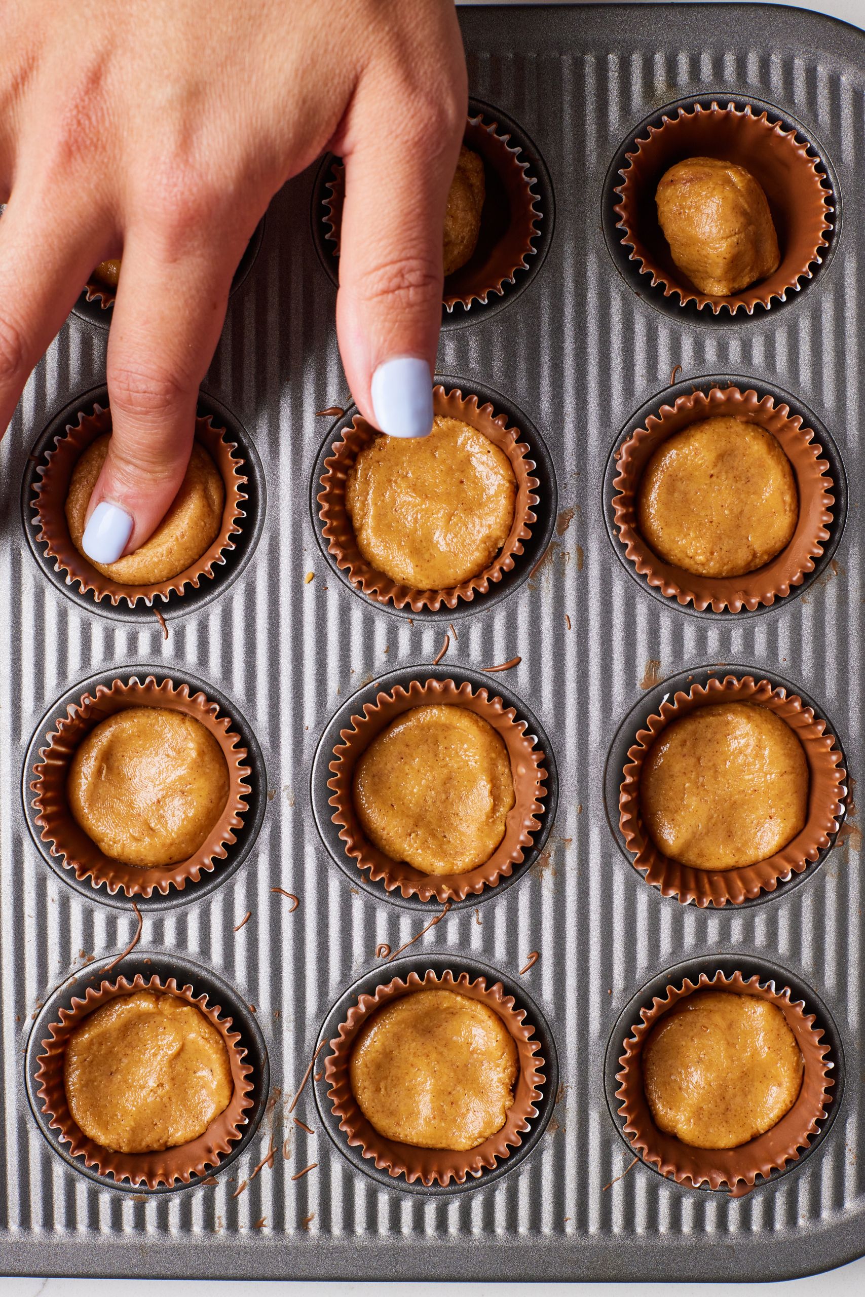 Fill each set chocolate cup with peanut butter filling 