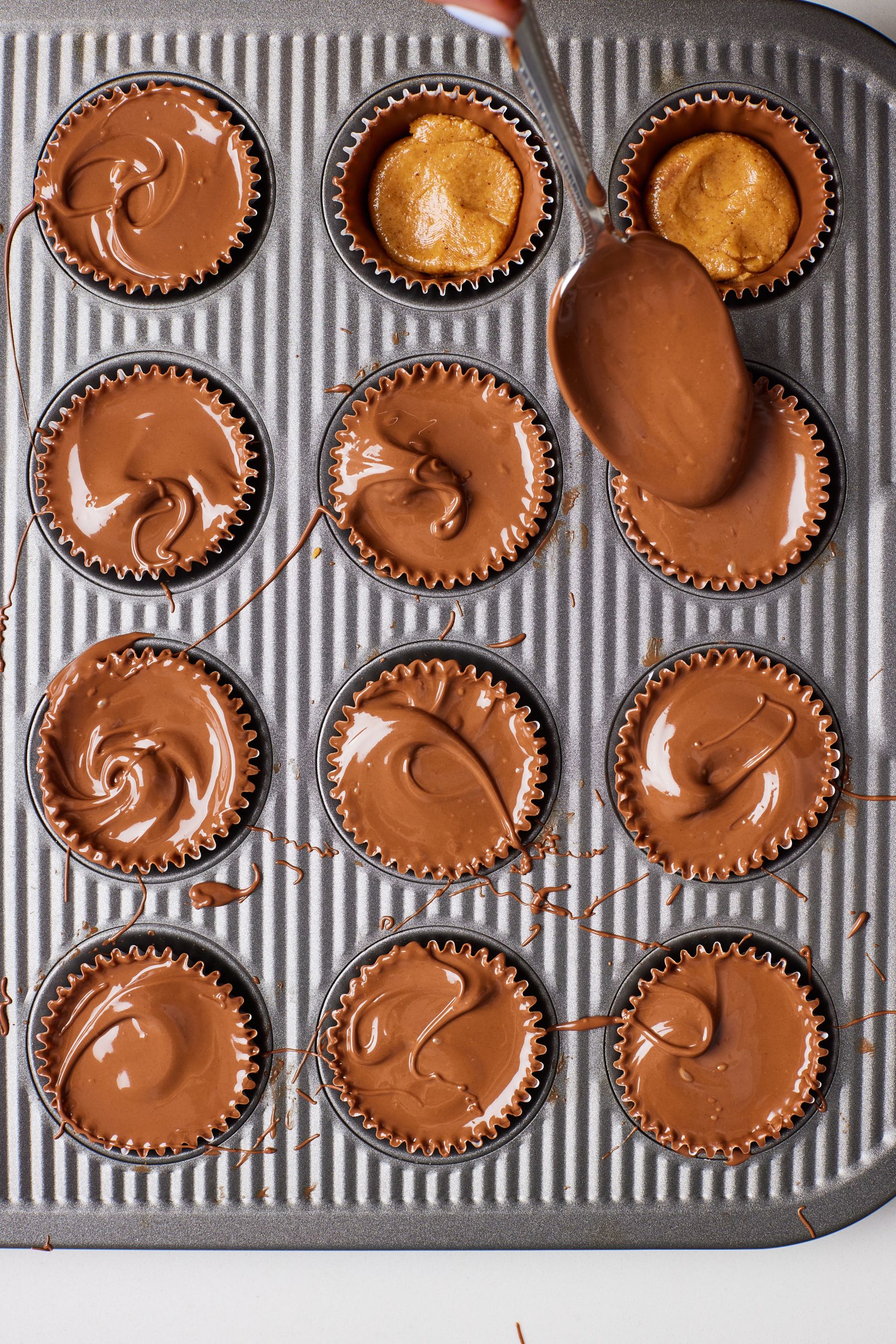 Top each Peanut Butte Cup with the remaining melted chocolate then chill again. 