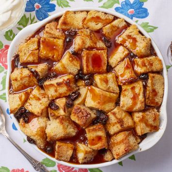 A top-down view of a bowl of Bread Butte Pudding With Whiskey Sauce.