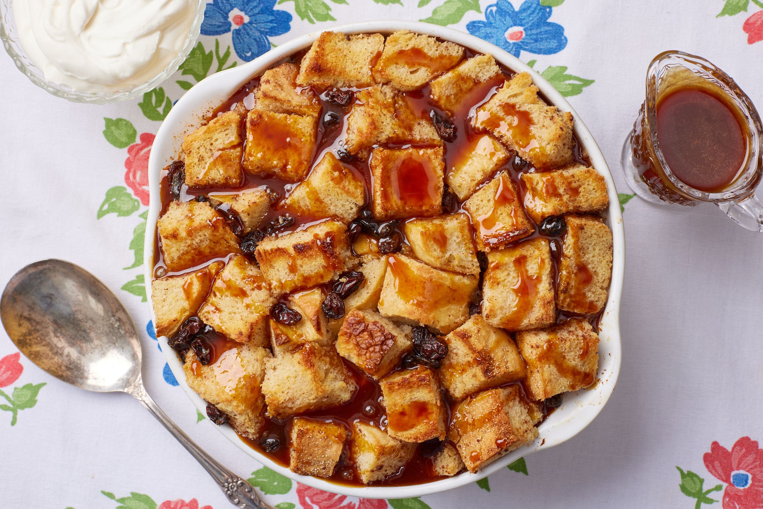 A top-down view of a bowl of Bread Butte Pudding With Whiskey Sauce.