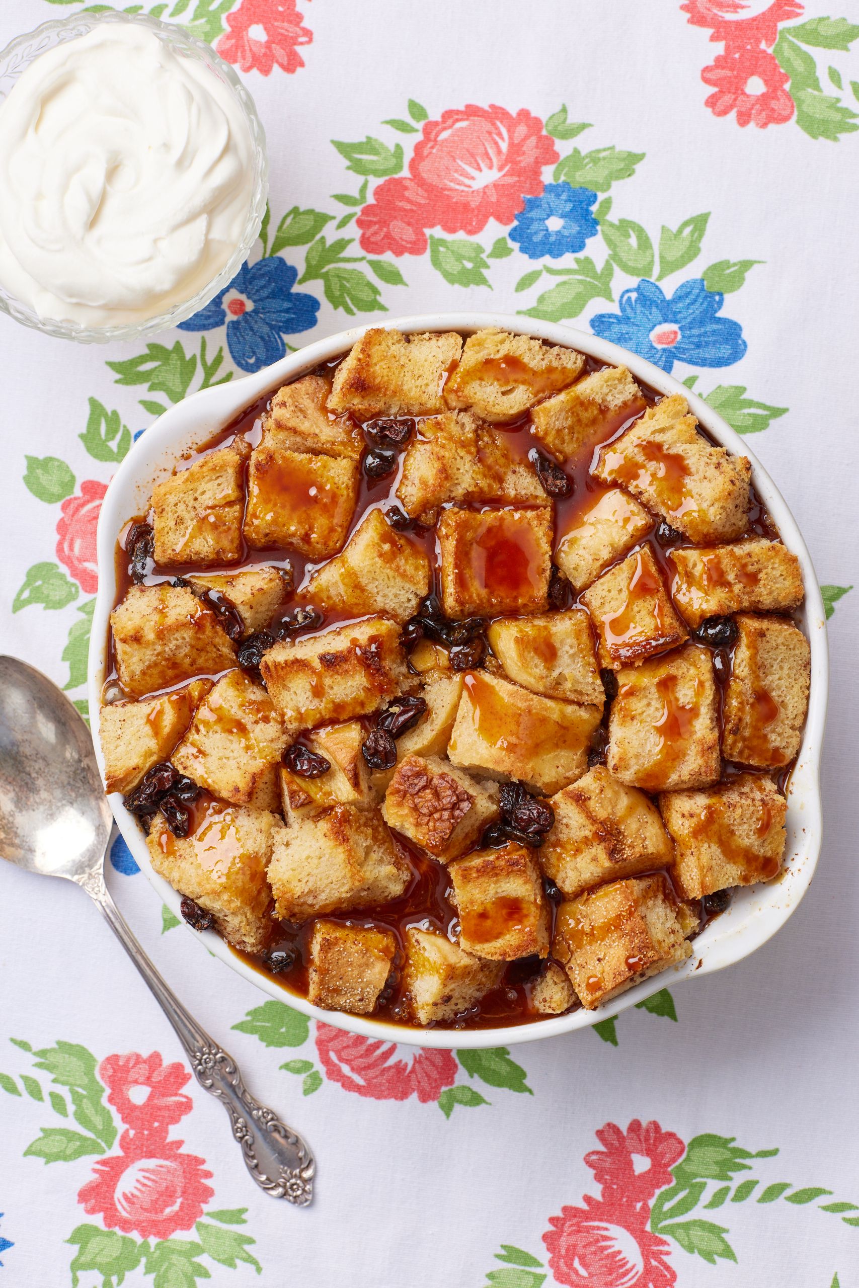 A top-down view of a bowl of Bread Butte Pudding With Whiskey Sauce. 