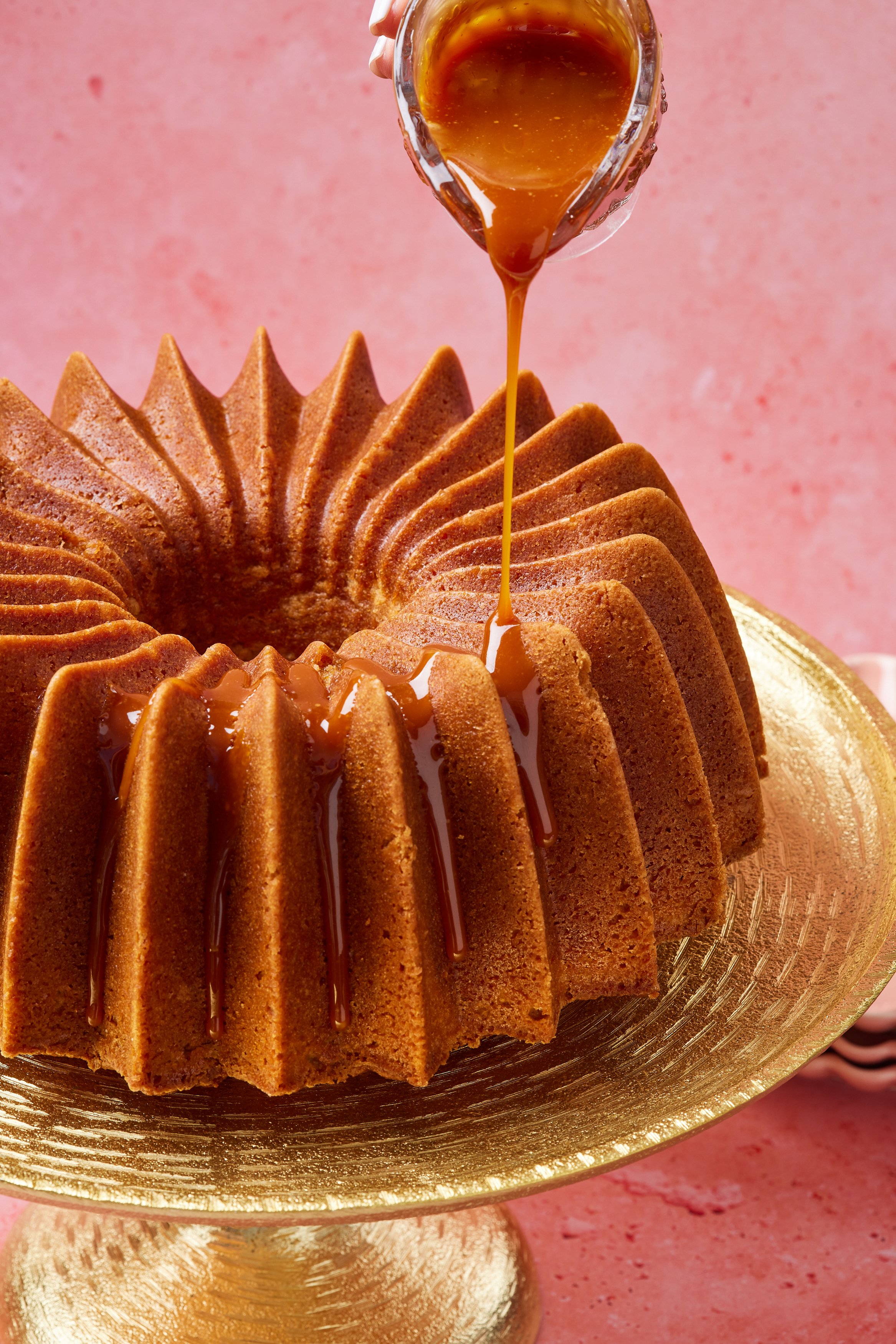 Glaze the cake : drizzle whiskey caramel sauce over the cake