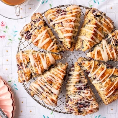 Blackberry Scones are divided into triangles and glazed.