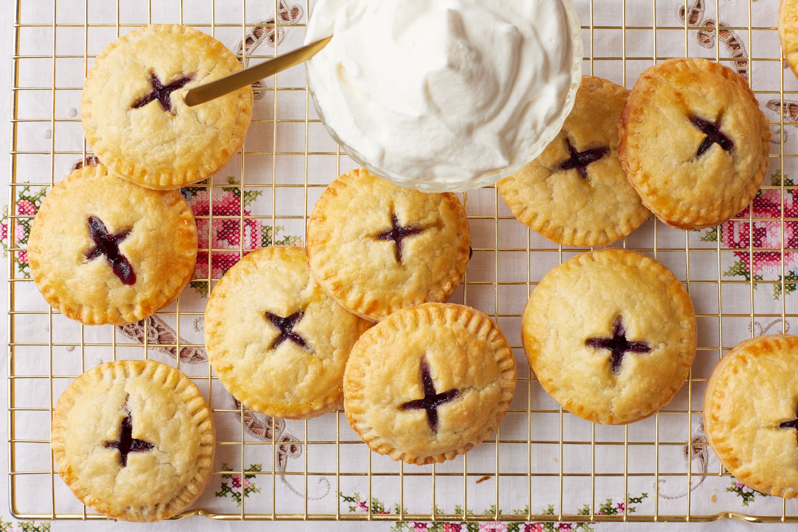 Top down view of Blueberry Pie Cookies served with a bowl of softly whipped cream