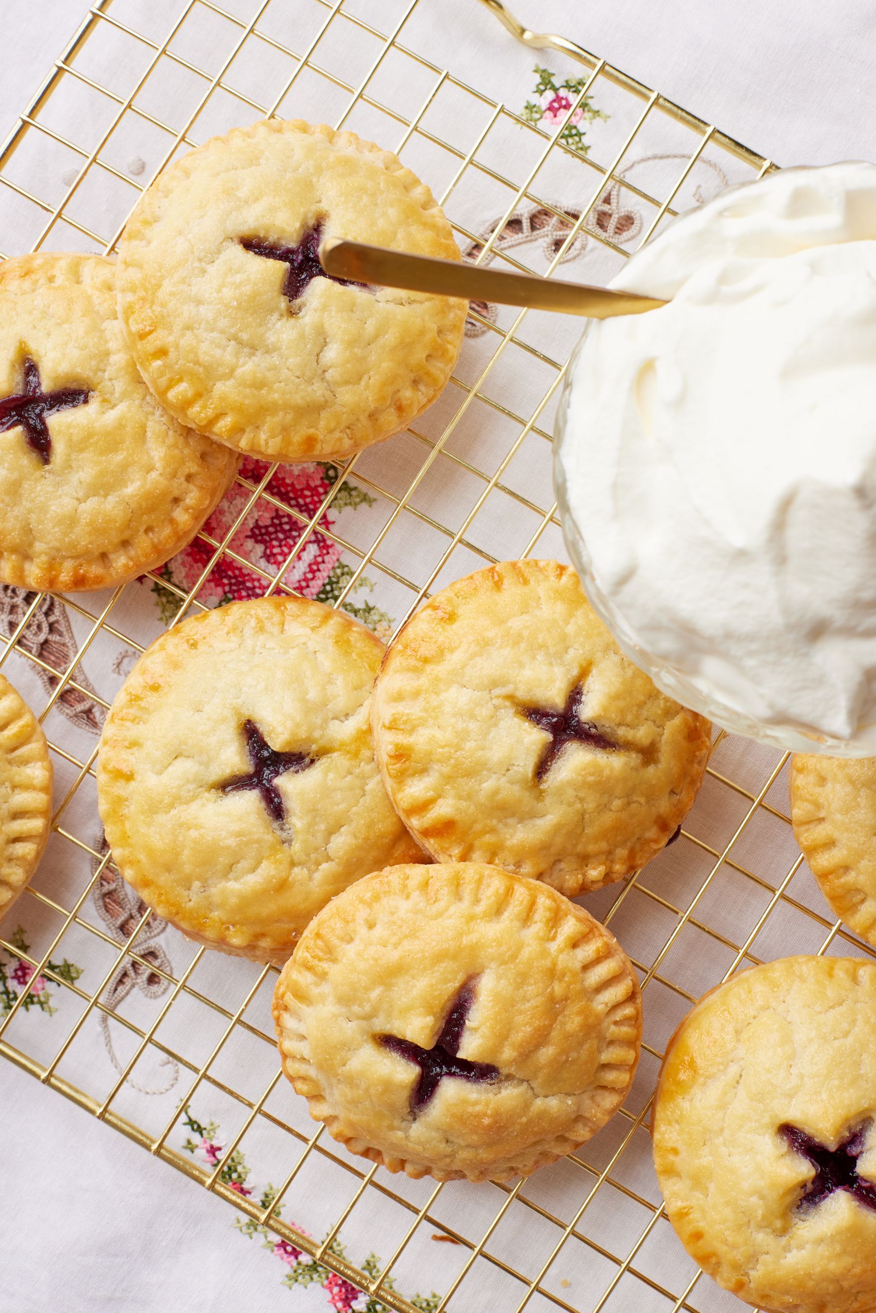 Blueberry Pie Cookies with a cross on top showing the filling. 