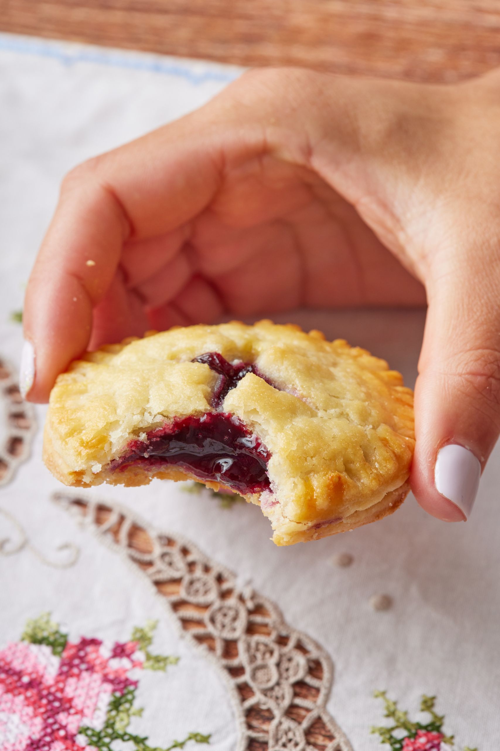 One cookie with a bite taken, which shows the gooey filling. 