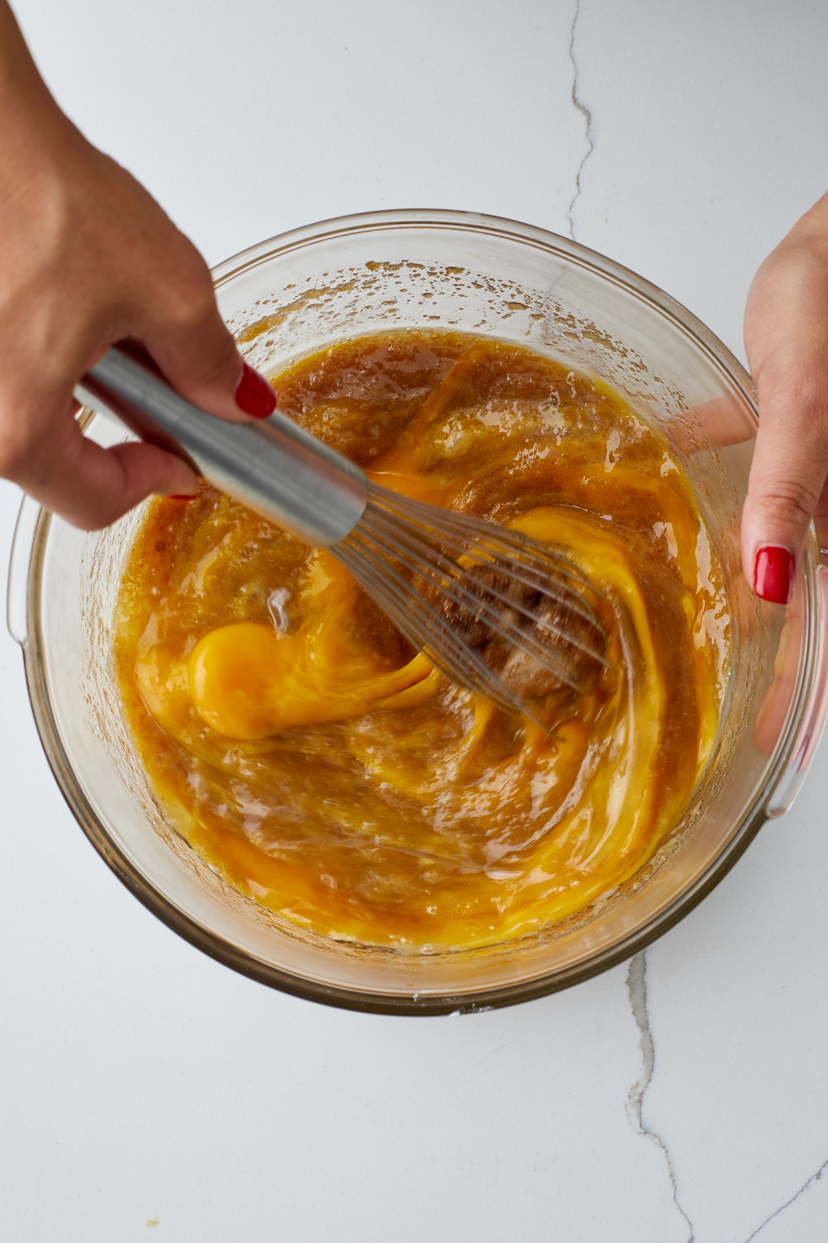 Step-by-step instructions on how to make Butterscotch Brownies: mix wet ingredients for the brownies batter. 
