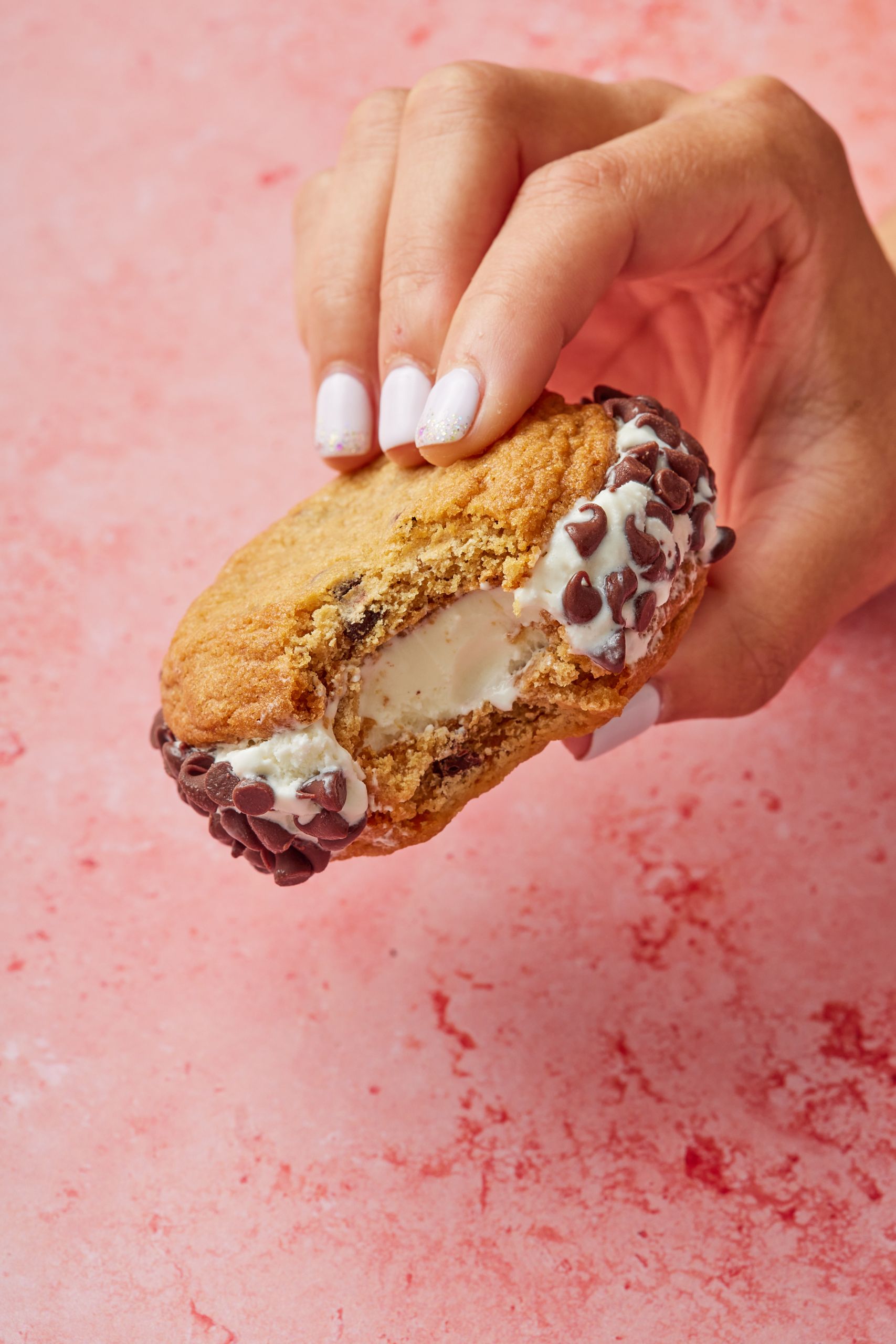 A cookie sandwich with one bite taken