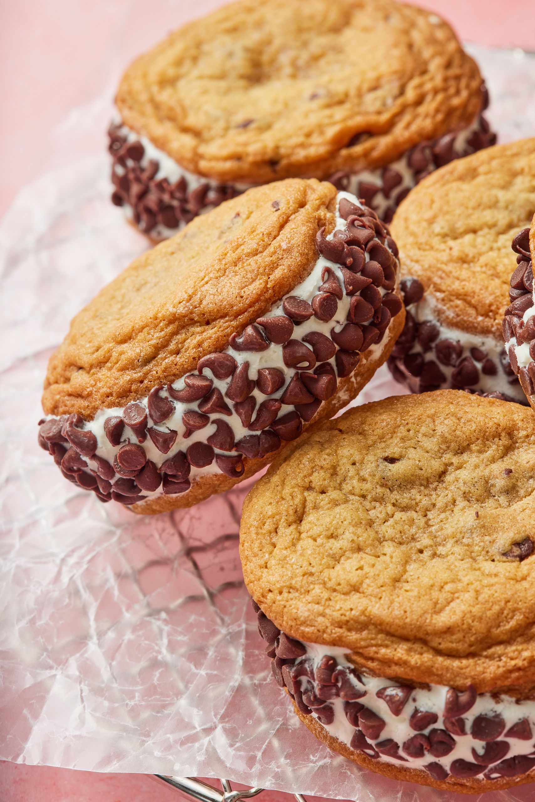 Four big Chocolate Chip Cookie Sandwiches with golden crinkle cookies coated with mini chocolate chips. 
