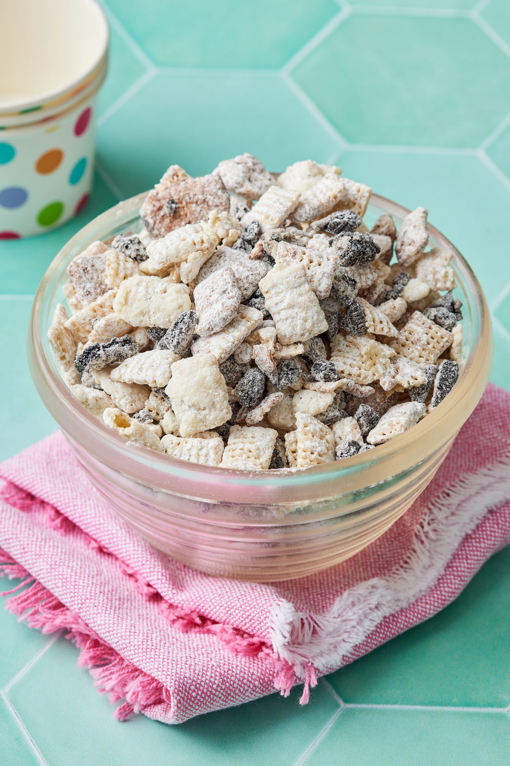 Cookies and cream muddy buddies5 A bowl of Cookies & Cream Muddy Buddies