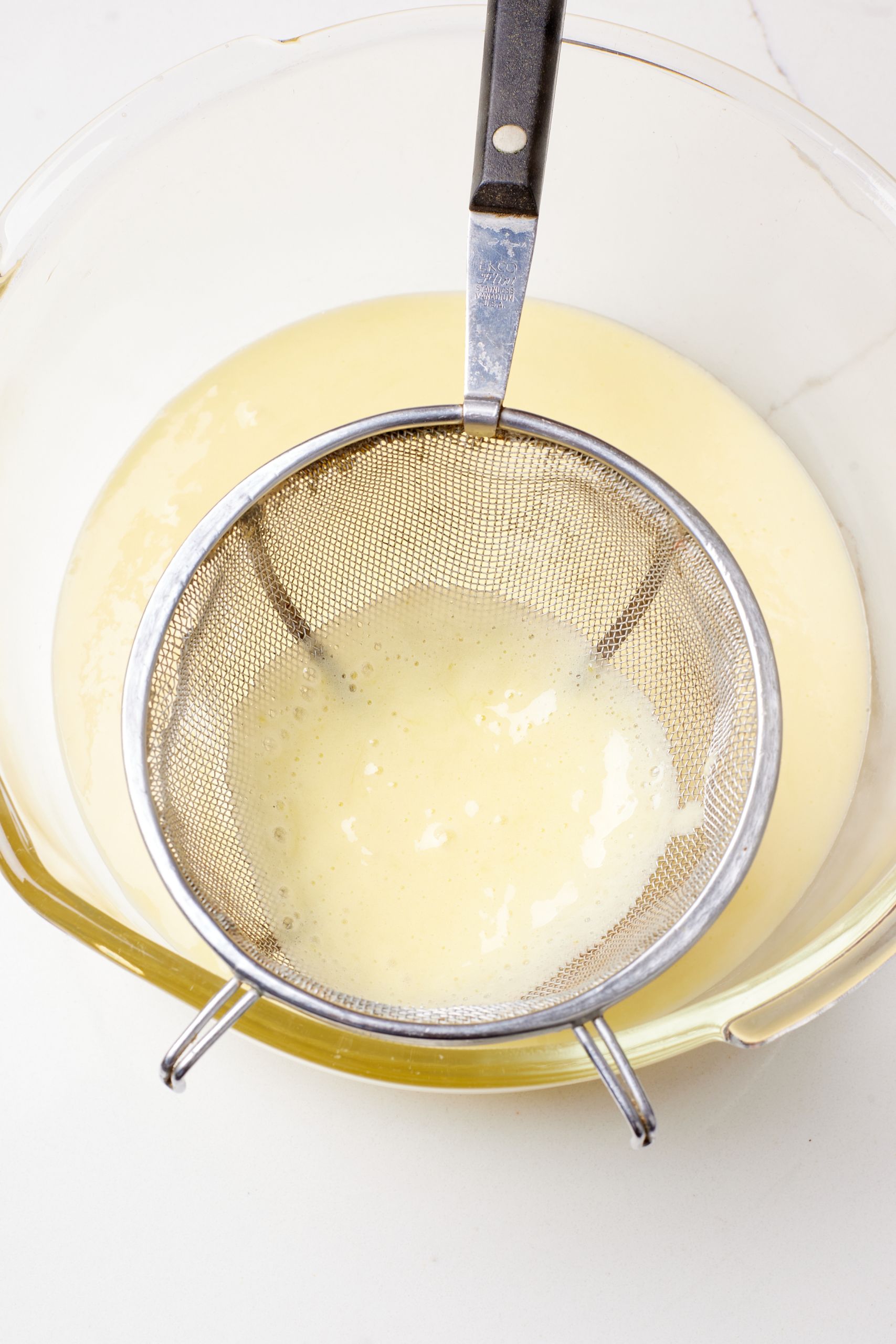 Strain the custard through a fine sieve