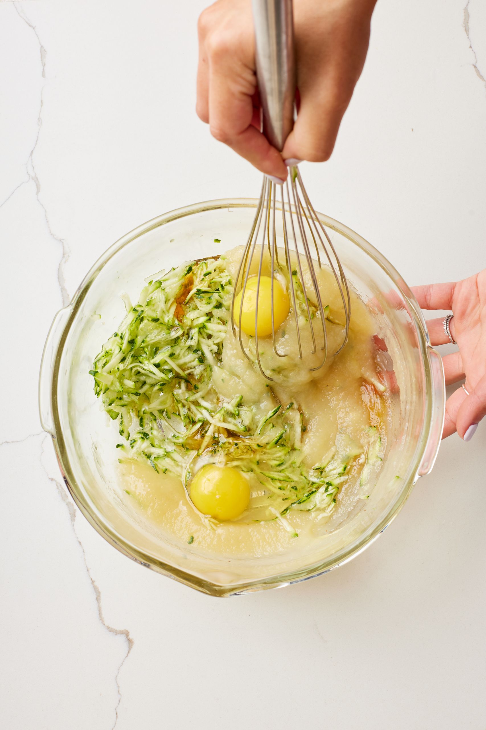 Add wet ingredients to the zucchini and mix until combined.