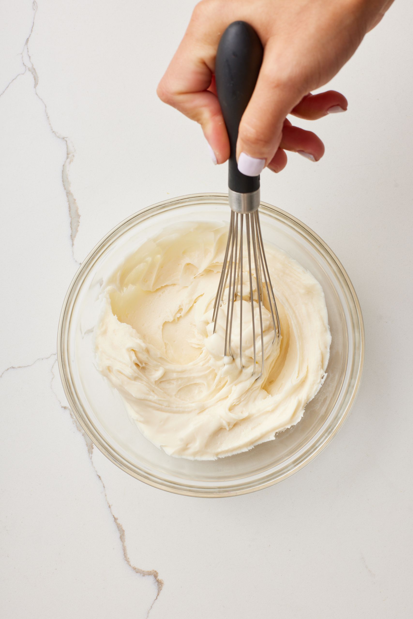 Make the cream cheese glaze: whisk it until thick and opaque but pourable.