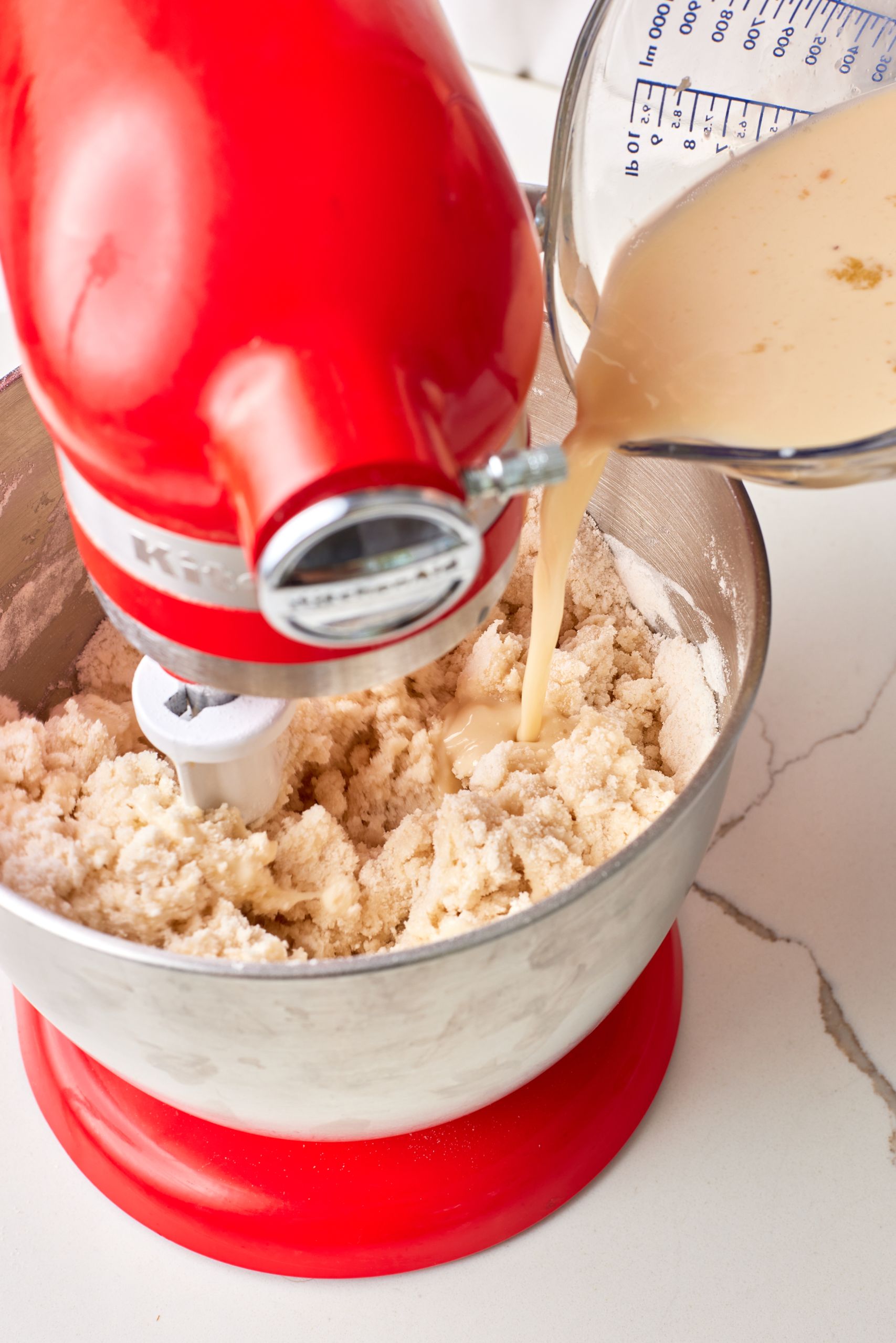 Step-by-step instructions on how to make Biscoff Cake: combine dry and wet ingredients together