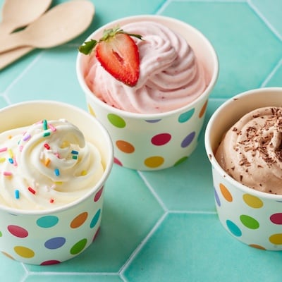 3 flavors of soft frozen yogurt served in polka dot cups.
