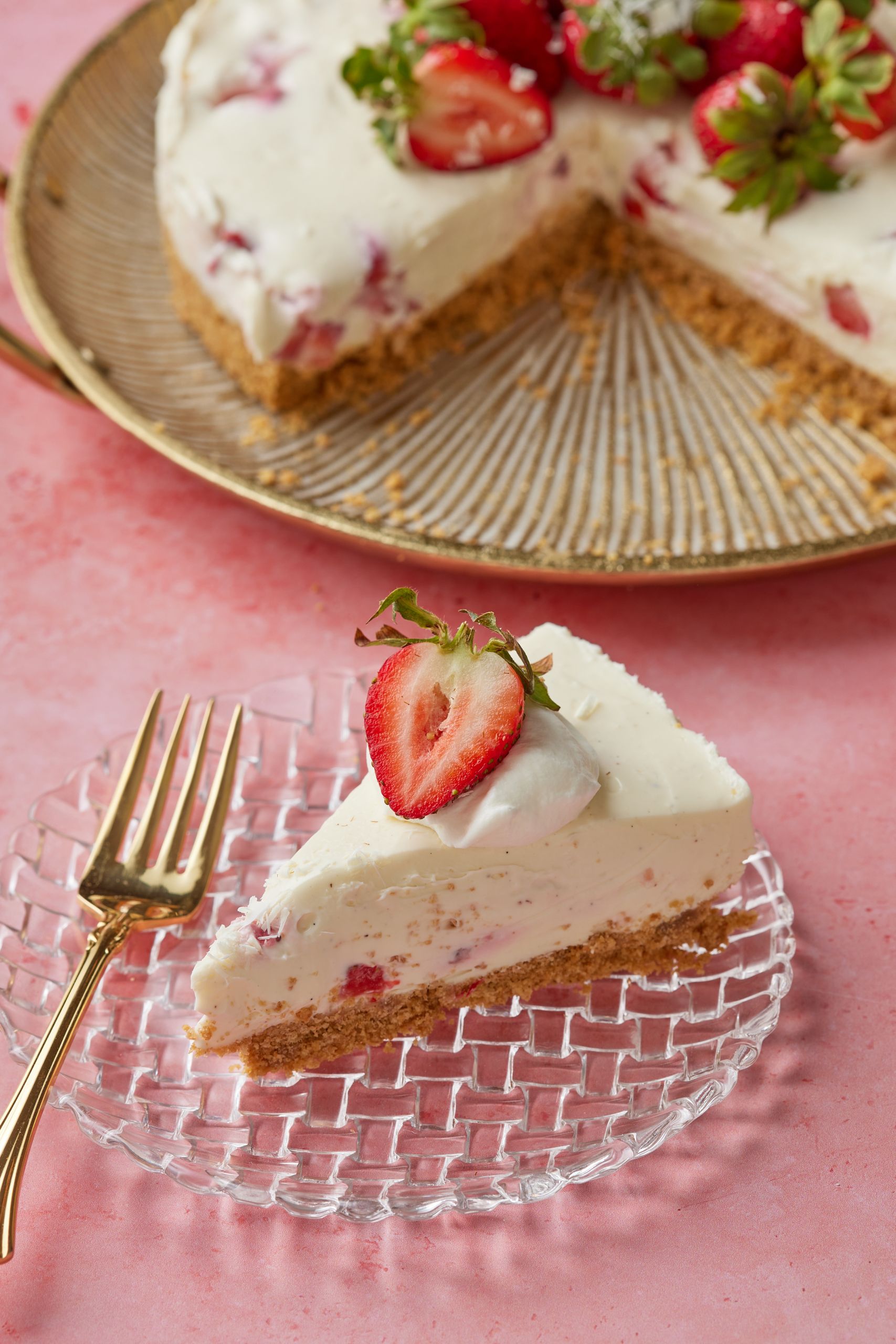 A slice of the no bake cheesecake is seven with whipped cream