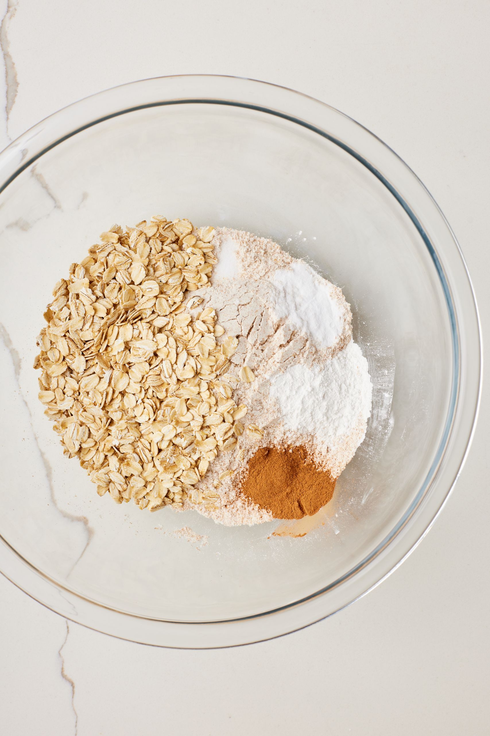 Mix dry ingredients: In a separate medium bowl, combine the flour, oats, cinnamon, baking powder, baking soda and salt.