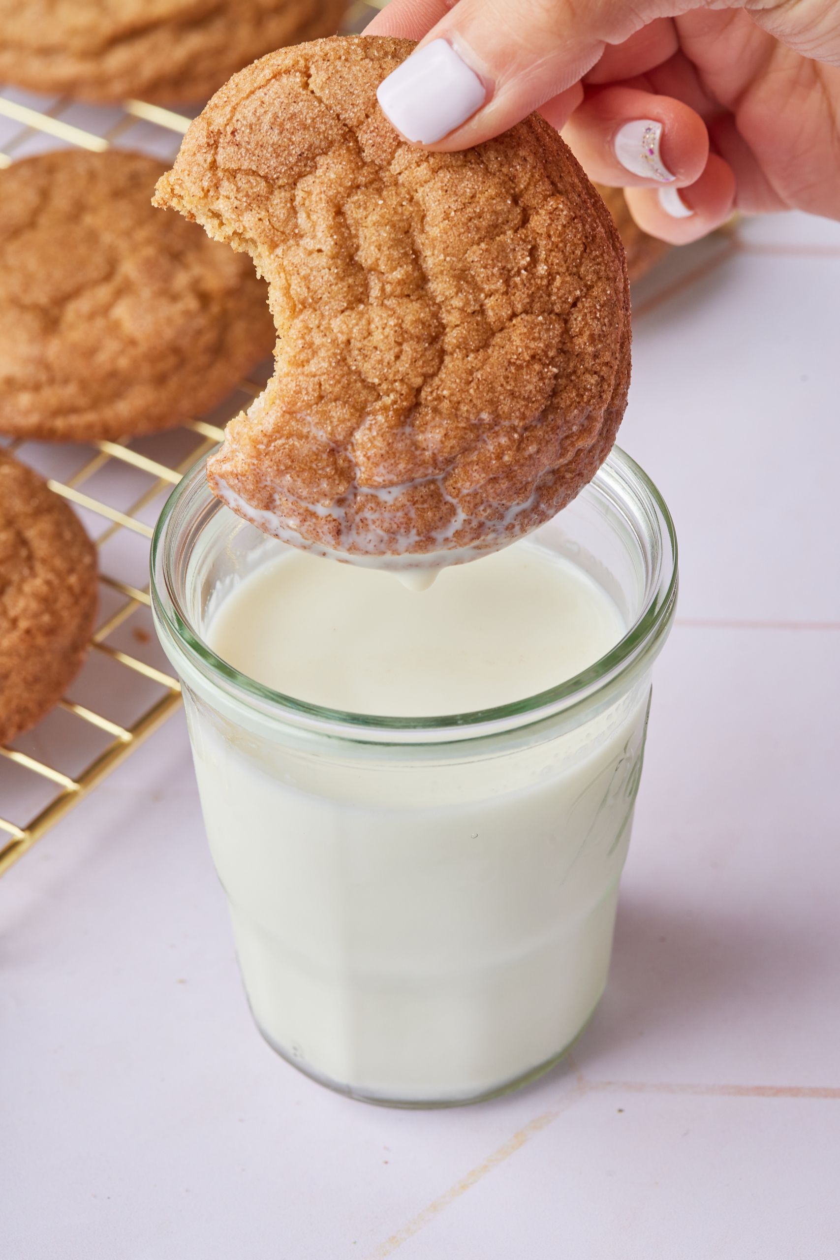 Applesauce cookie dipping into milk.
