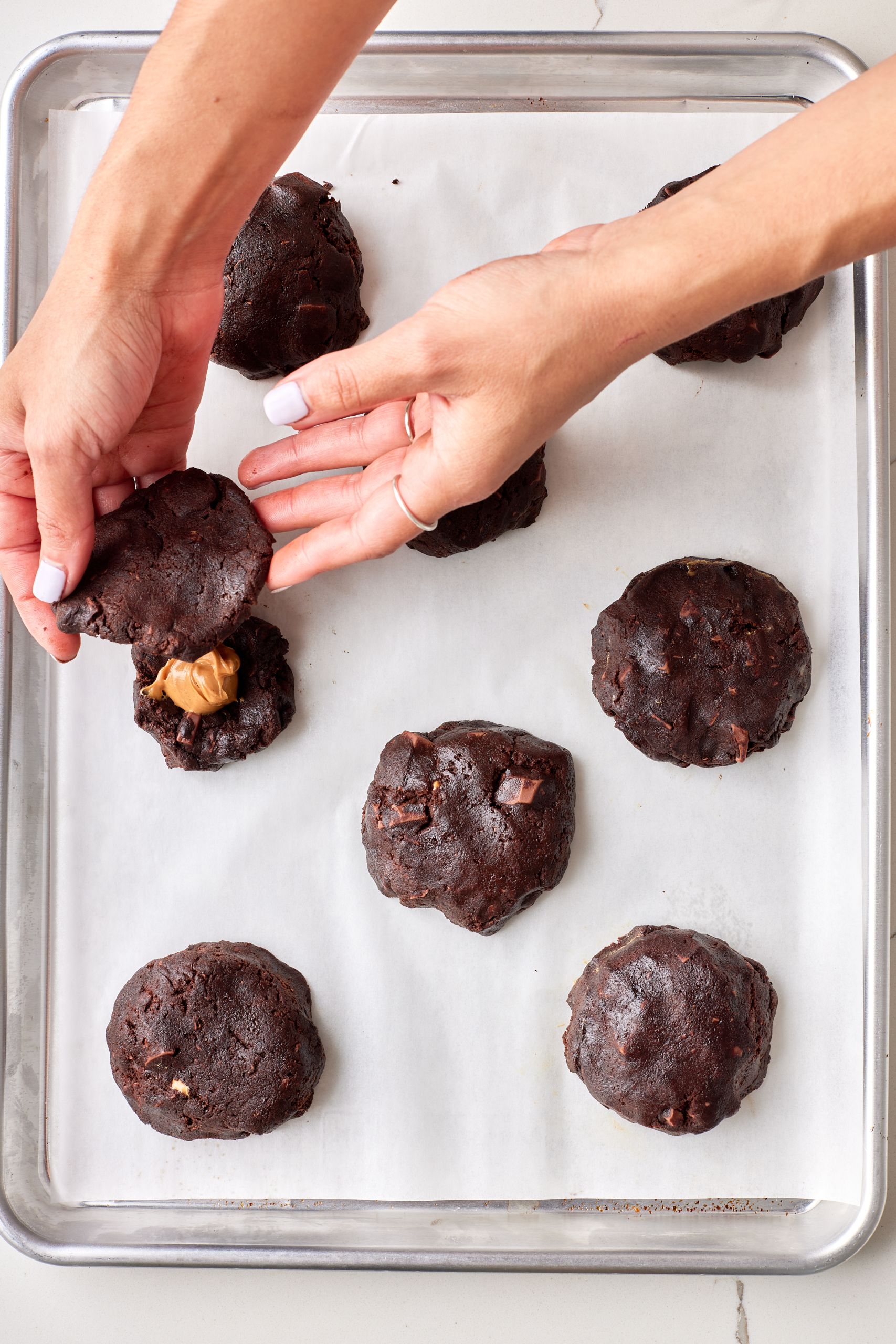 Top the cookies with chocolate cookie dough. 