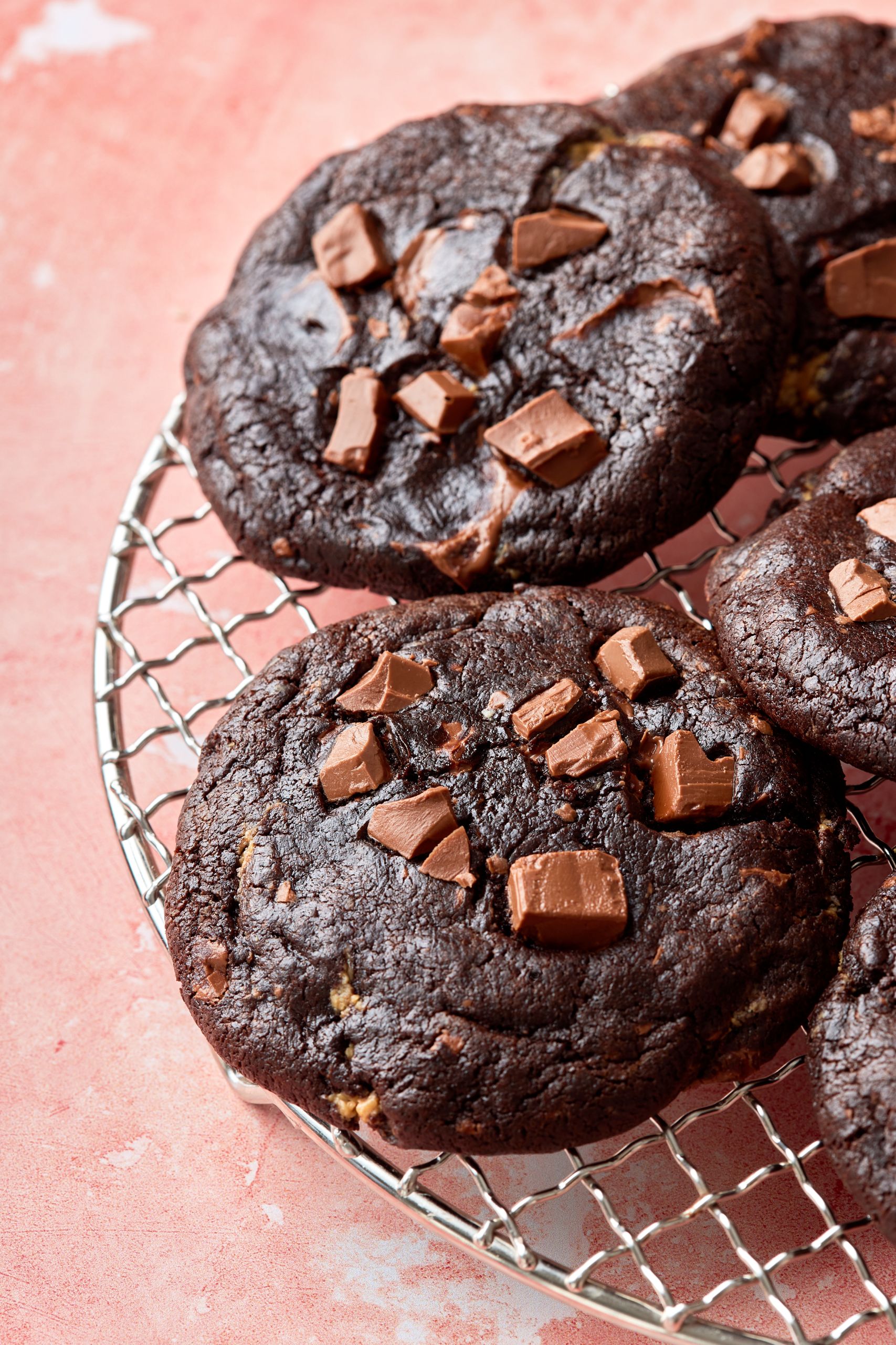 A close-up shot at big chocolate peanut butter stuffed cookies. 